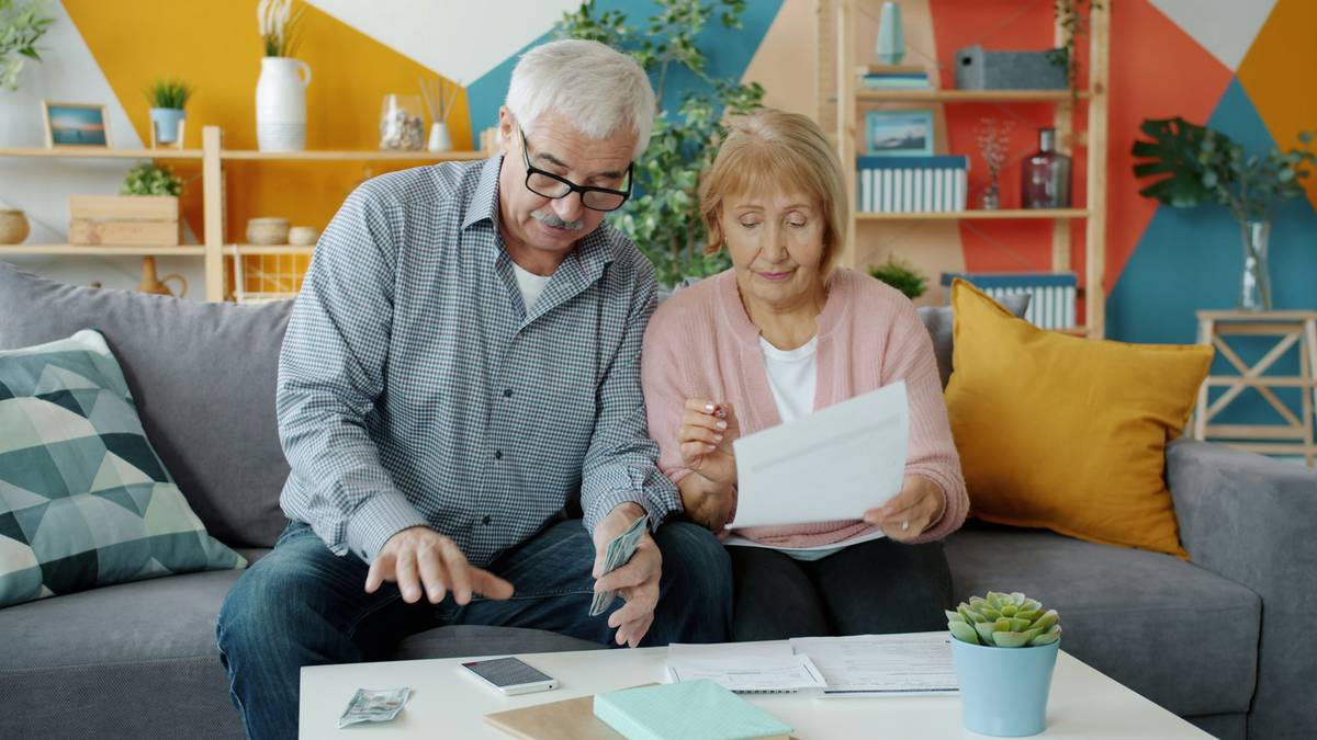Homeowner reviewing solar panel insurance documents with renewable resource panel insurance option are highlighted on a checklist